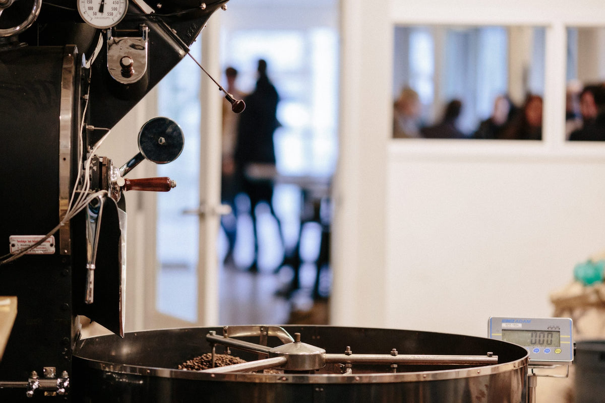 The coffee roaster at the Elysian roastery, with freshly roasted beans in the cooling tray