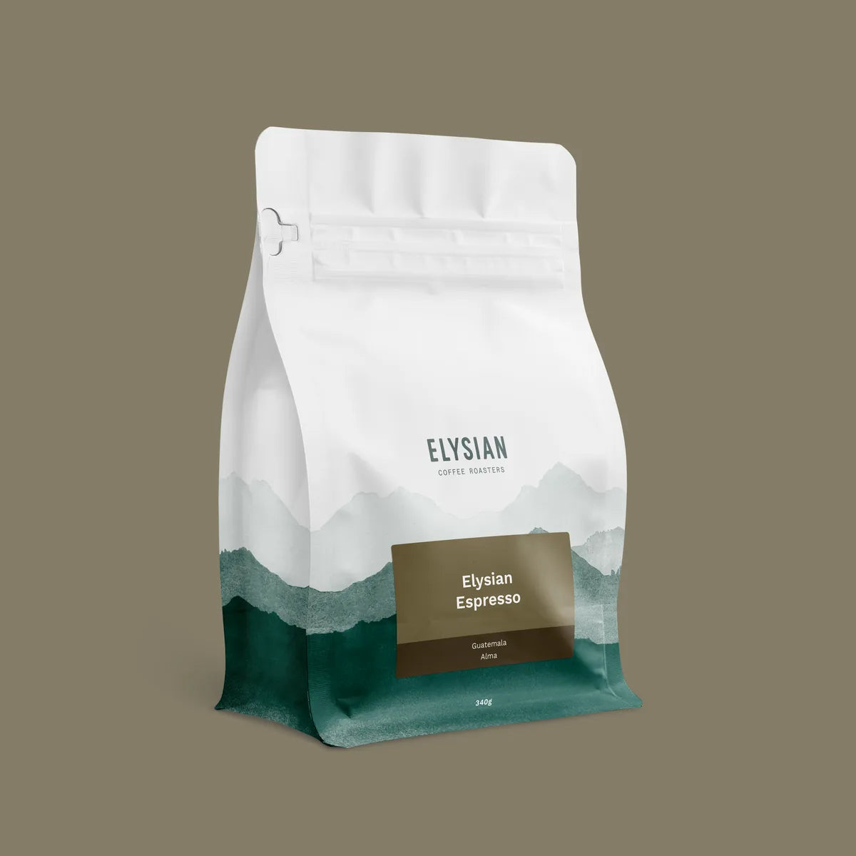 Elysian Espresso coffee bag, white with painted green mountains, on a taupe background